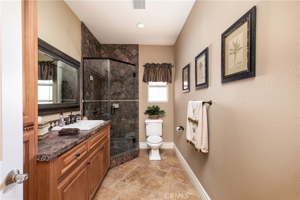 7899 Rio Vista Drive Big River, CA 92242 - Photo 17 of 74 a bathroom with a sink a toilet and shower
