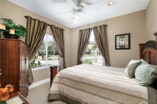 a living room with fireplace furniture and a flat screen tv