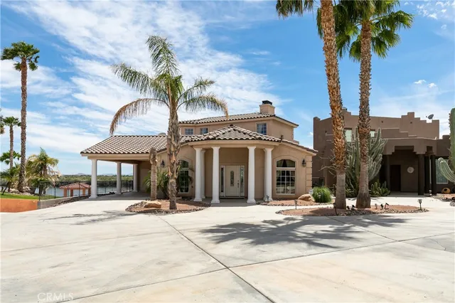 a view of a building with a palm tree