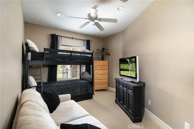 a large bathroom with a granite countertop double vanity sink and a mirror
