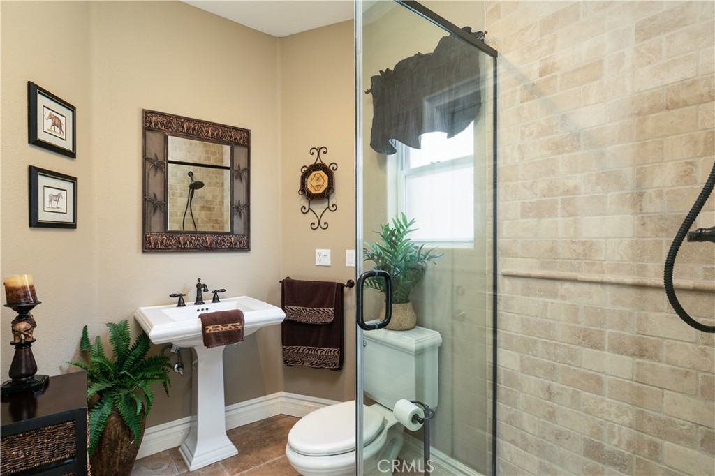 7899 Rio Vista Drive Big River, CA 92242 - Photo 22 of 74 a bathroom with a toilet a sink and mirror