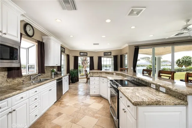 a view of a swimming pool with an outdoor seating