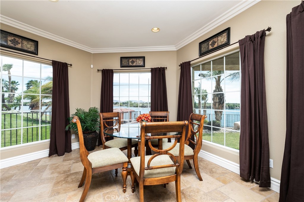 7899 Rio Vista Drive Big River, CA 92242 - Photo 27 of 74 a dining room with furniture and a floor to ceiling window