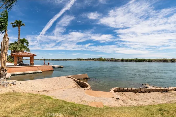 a living room with furniture and a view of bedroom