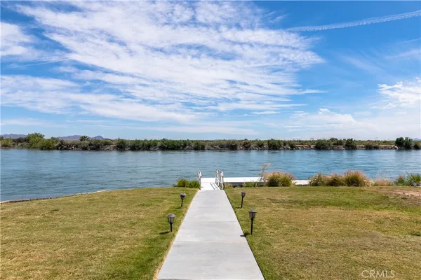 a bedroom with a bed couch and window