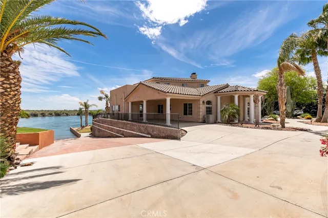 a bed room with furniture and a flat screen tv
