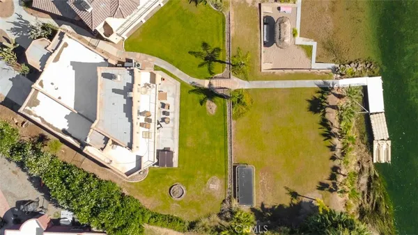a bathroom with a granite countertop toilet sink and mirror