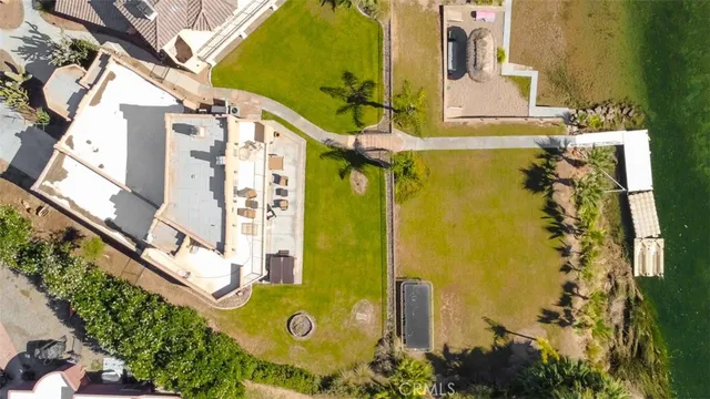 a bathroom with a granite countertop toilet sink and mirror