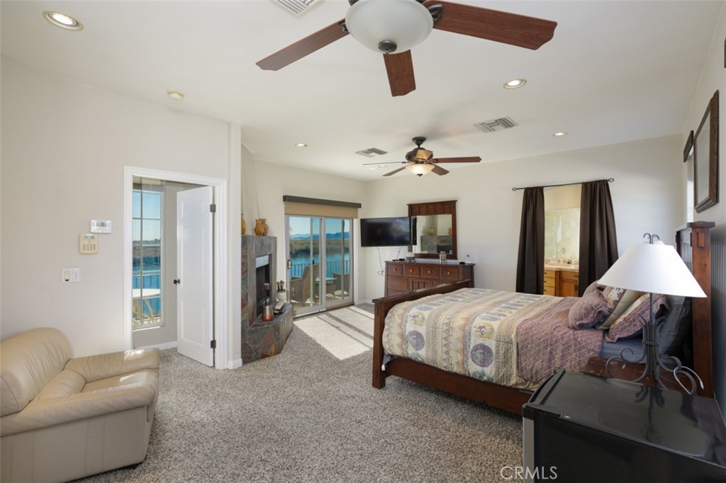 7899 Rio Vista Drive Big River, CA 92242 - Photo 62 of 74 a bedroom with a bed couch and window