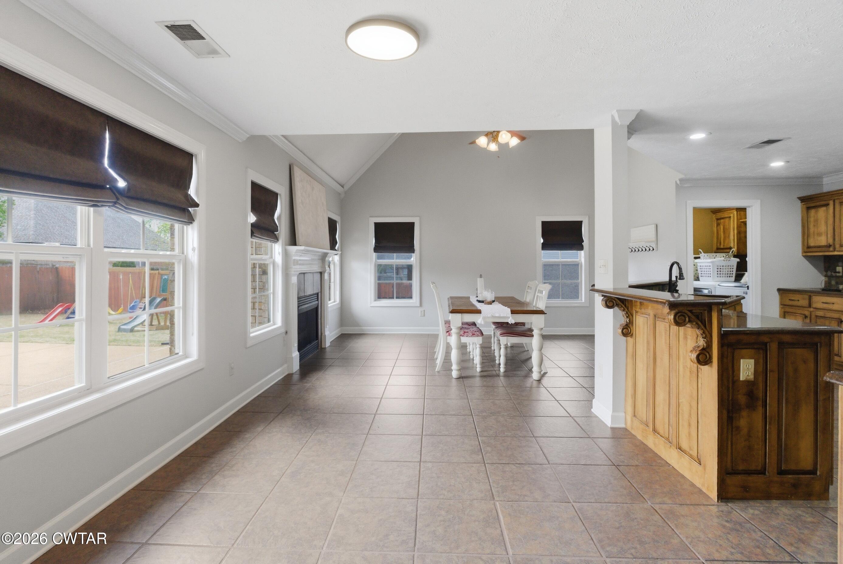 325 Harvest Ridge Lane Medina, TN 38355 - Photo 12 of 43 a living room with furniture a dining table and kitchen view