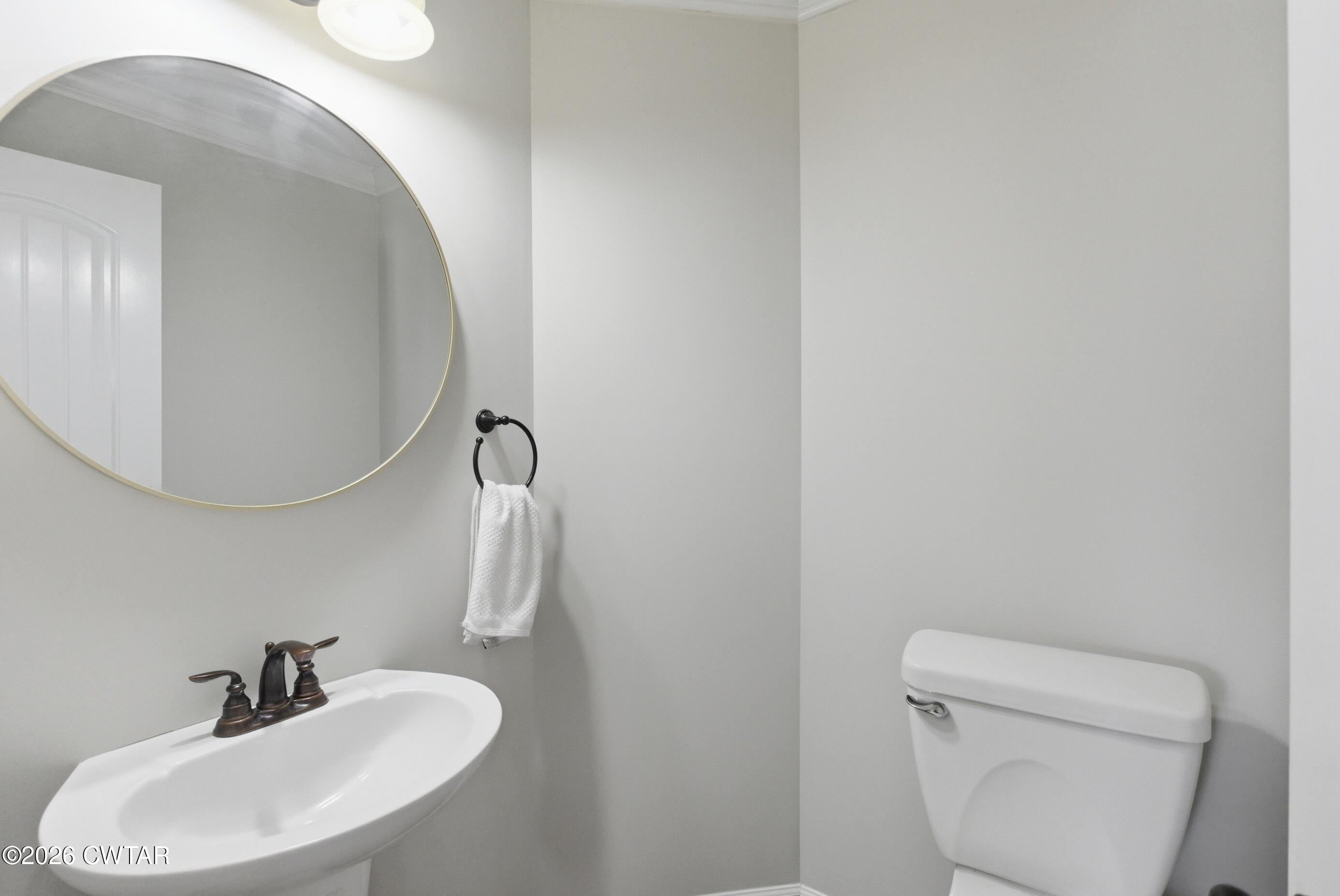 325 Harvest Ridge Lane Medina, TN 38355 - Photo 20 of 43 a bathroom with a toilet sink and mirror