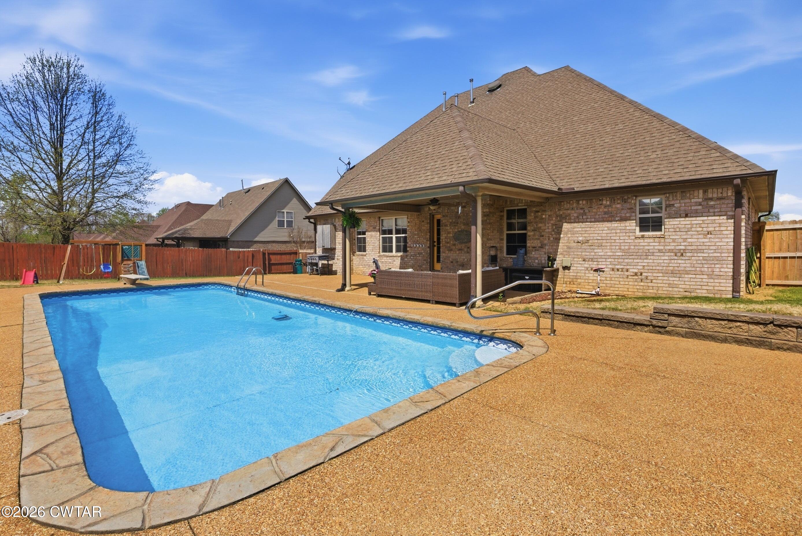 325 Harvest Ridge Lane Medina, TN 38355 - Photo 2 of 43 swimming pool view with a outdoor seating