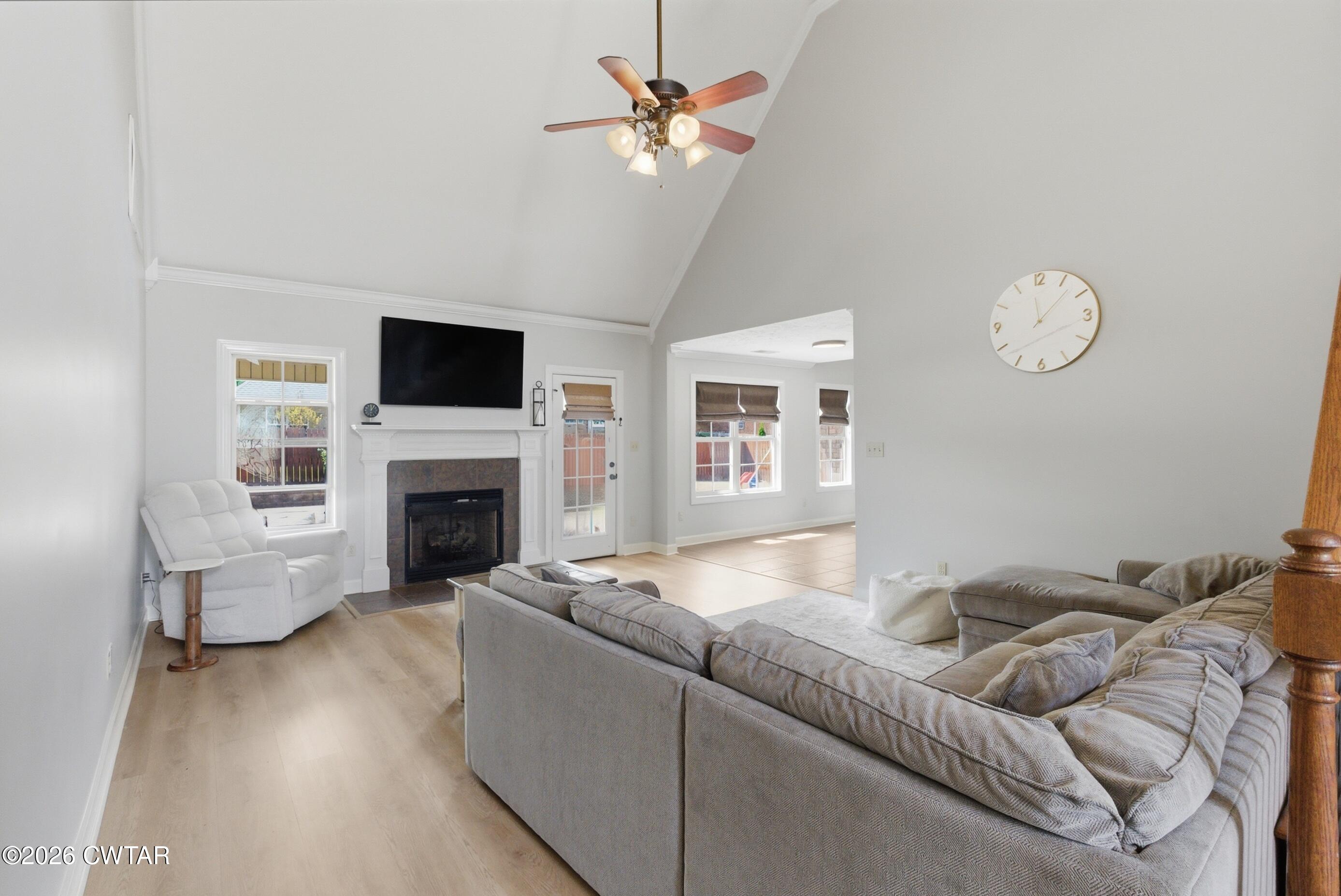325 Harvest Ridge Lane Medina, TN 38355 - Photo 22 of 43 a living room with furniture fireplace and a flat screen tv
