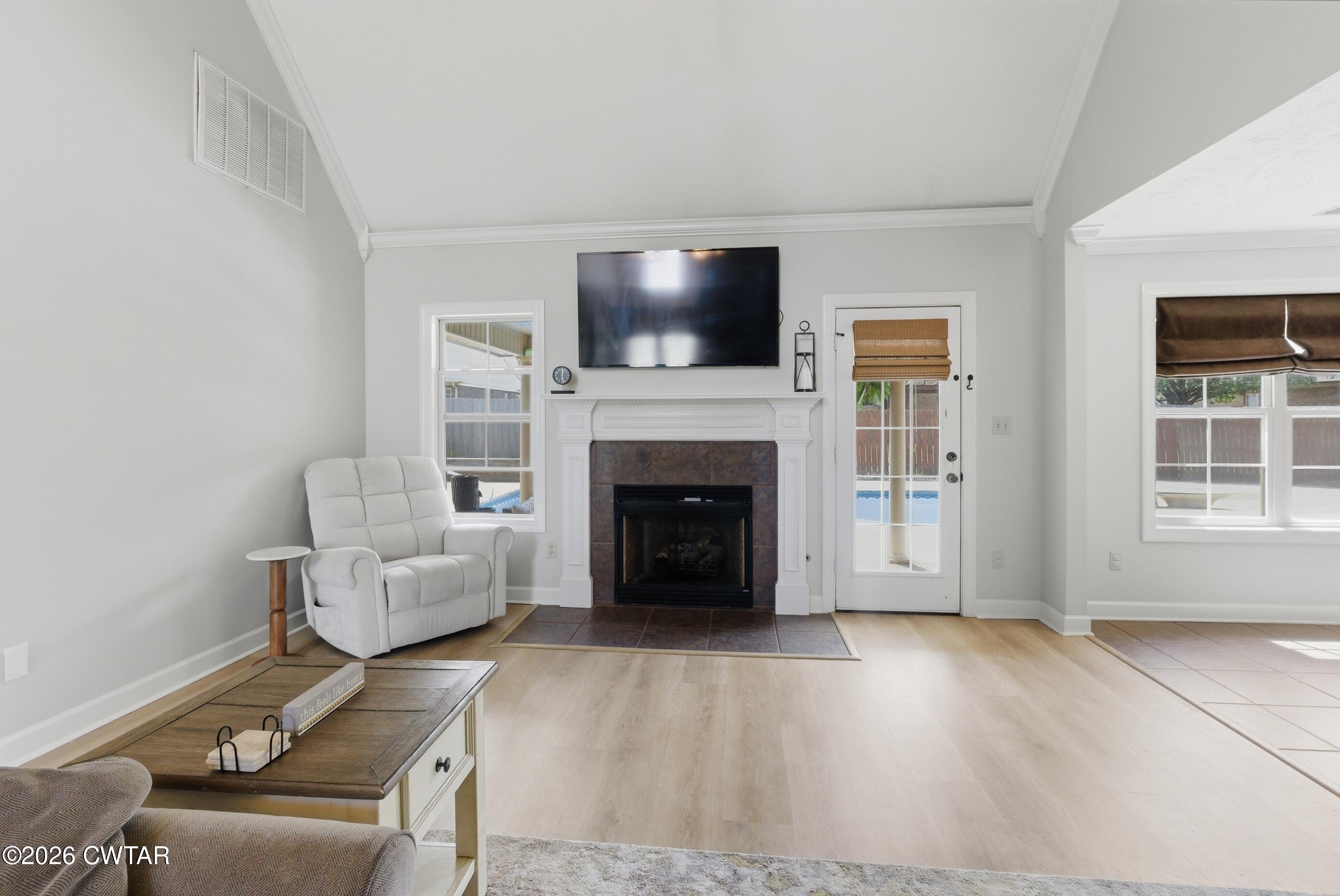 325 Harvest Ridge Lane Medina, TN 38355 - Photo 23 of 43 a living room with furniture a flat screen tv and a fireplace