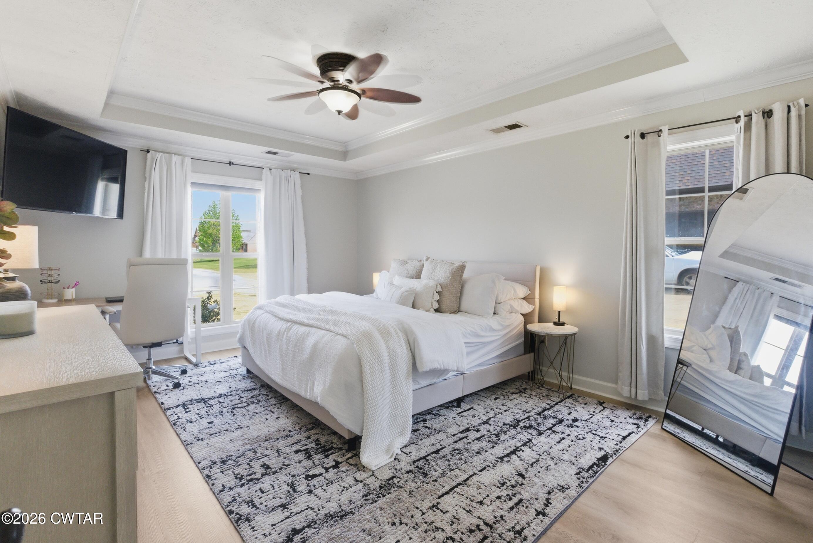 325 Harvest Ridge Lane Medina, TN 38355 - Photo 26 of 43 a bed room with a bed a couch and a flat tv screen