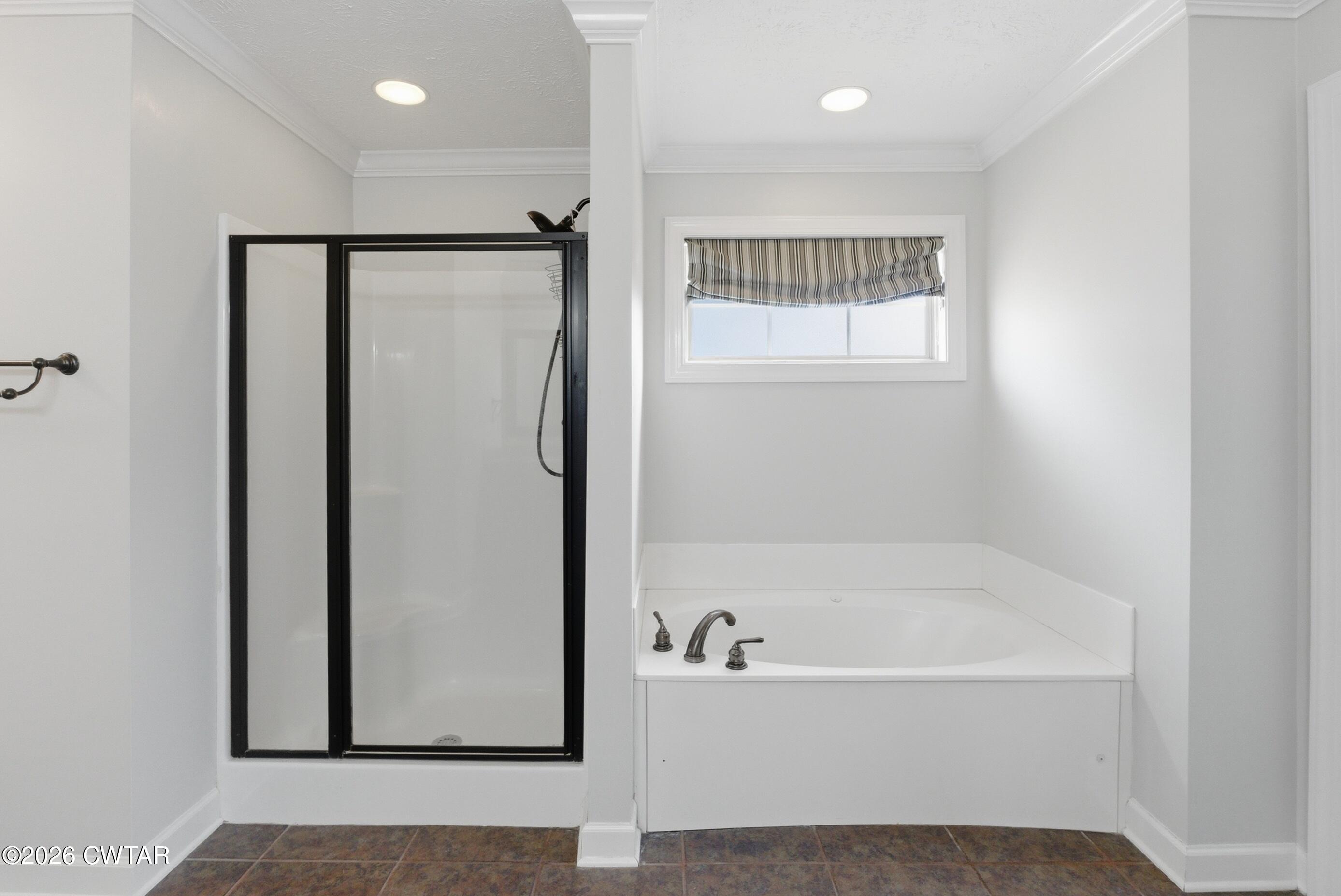 325 Harvest Ridge Lane Medina, TN 38355 - Photo 27 of 43 a bathroom with a bathtub and a shower
