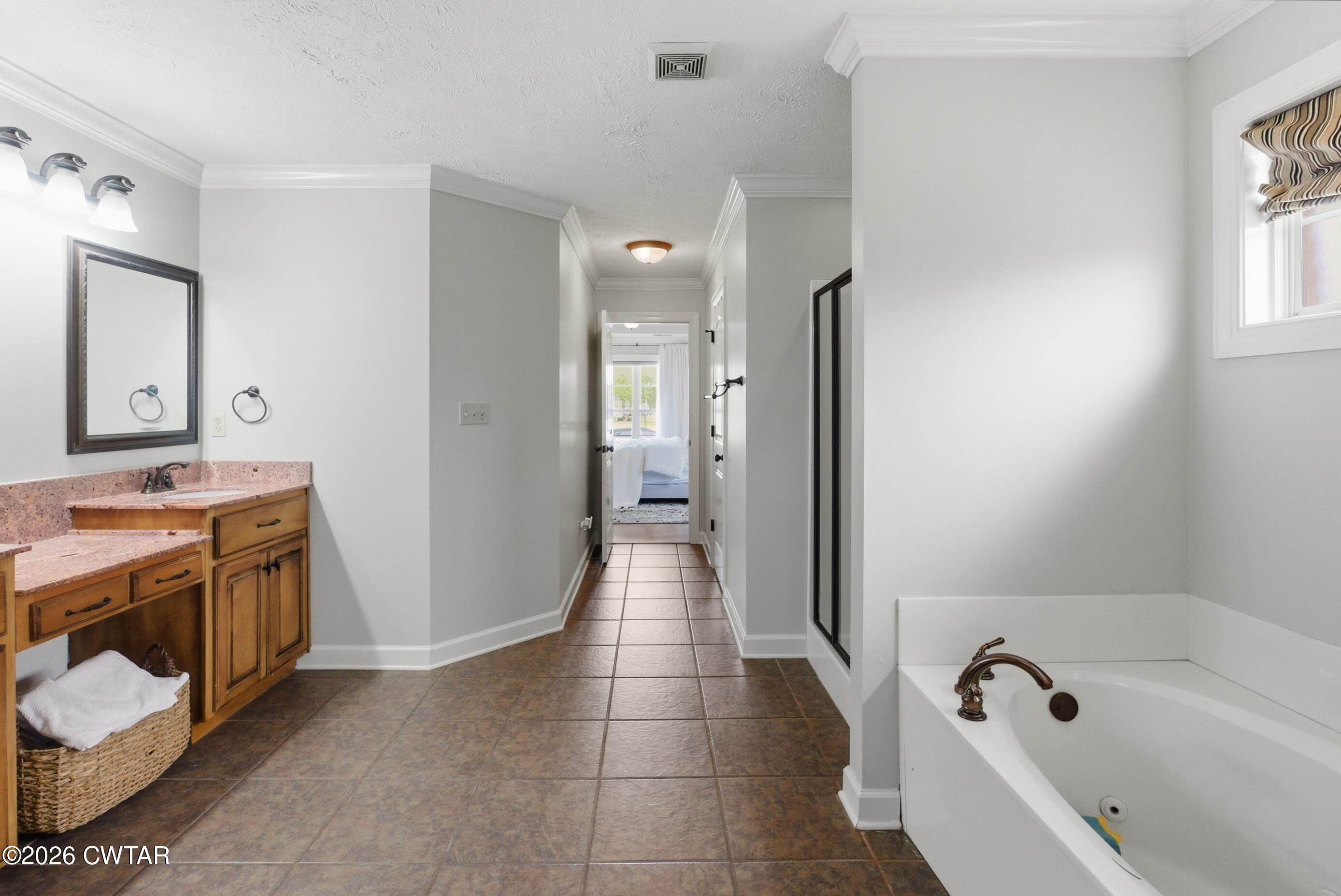 325 Harvest Ridge Lane Medina, TN 38355 - Photo 28 of 43 a bathroom with a bathtub sink and a mirror