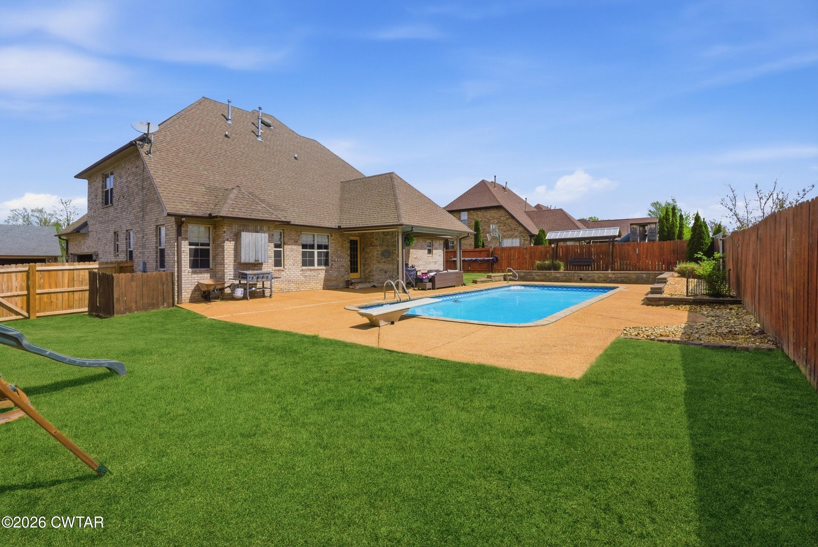 325 Harvest Ridge Lane Medina, TN 38355 - Photo 3 of 43 a view of a house with swimming pool and yard