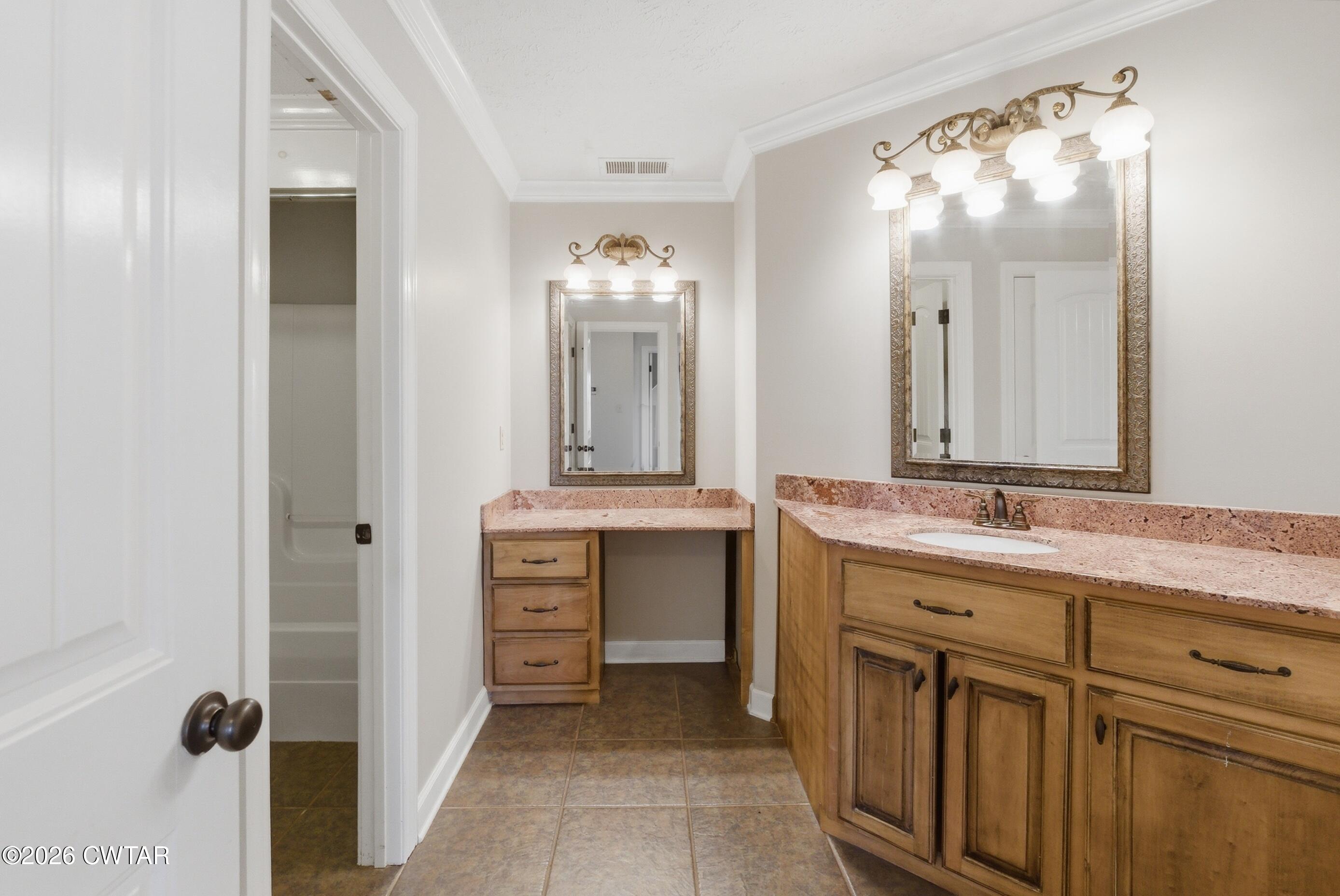 325 Harvest Ridge Lane Medina, TN 38355 - Photo 34 of 43 a bathroom with a double vanity sink and mirror