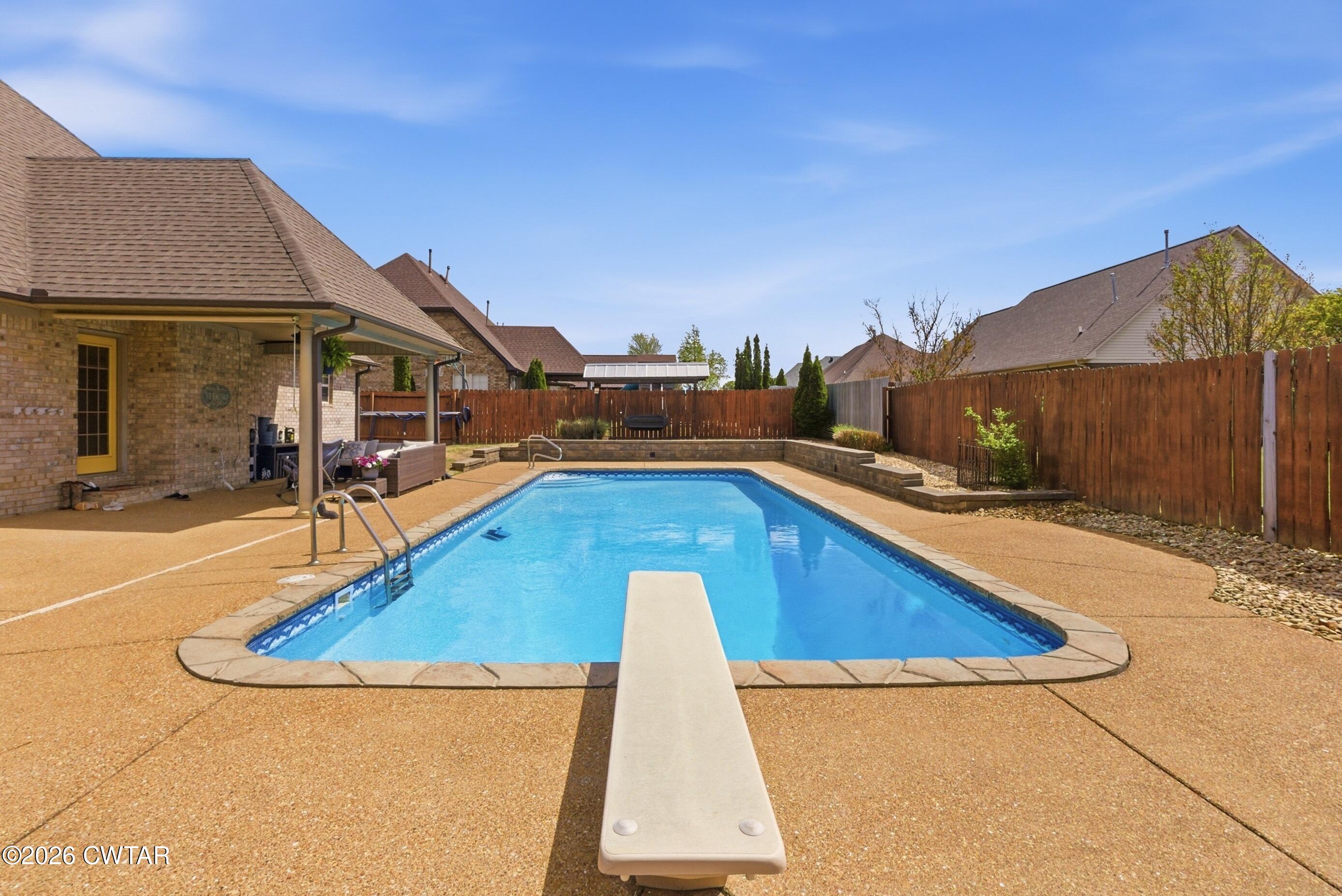 325 Harvest Ridge Lane Medina, TN 38355 - Photo 40 of 43 a view of a swimming pool with a lounge chairs