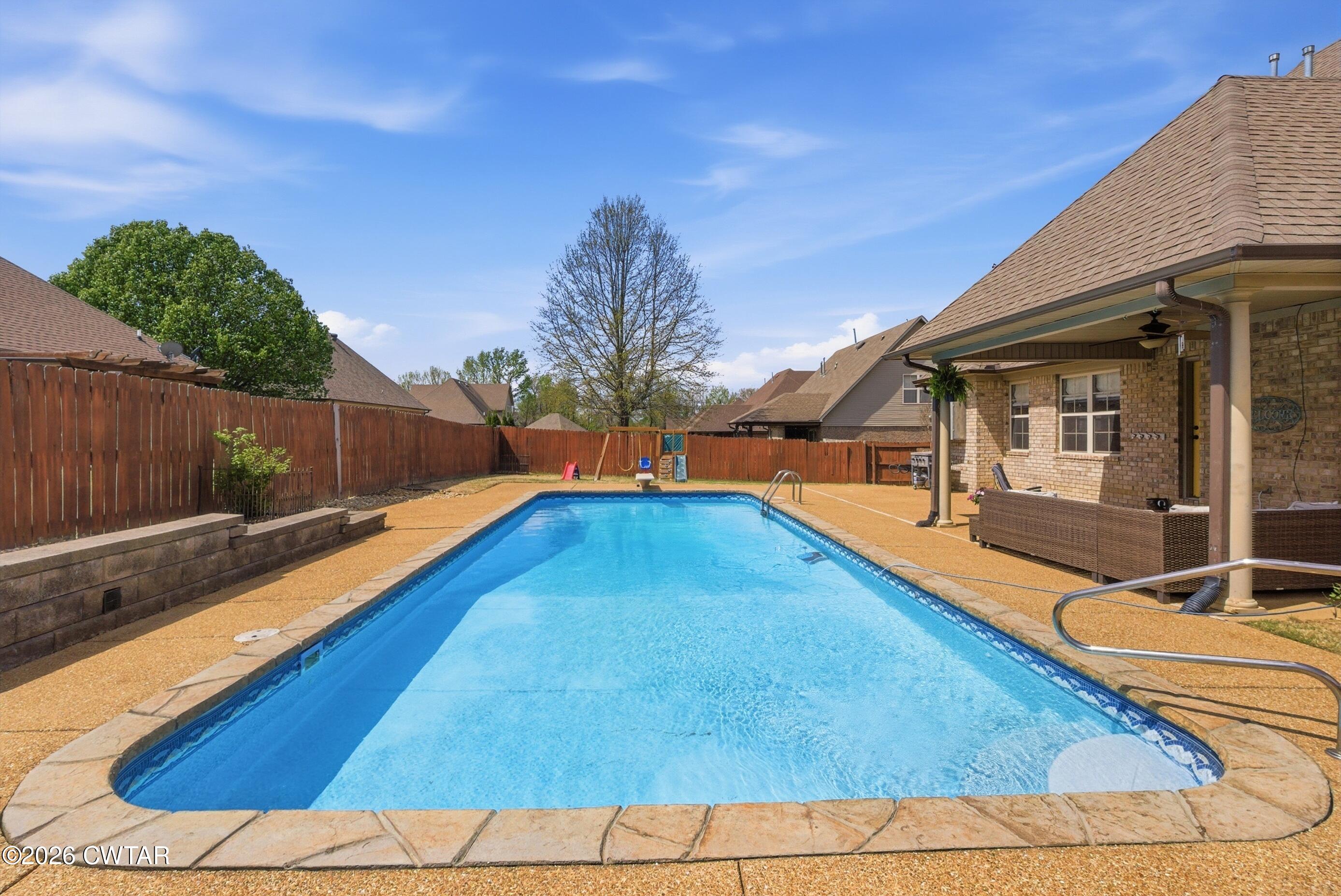 325 Harvest Ridge Lane Medina, TN 38355 - Photo 41 of 43 a view of a backyard with swimming pool