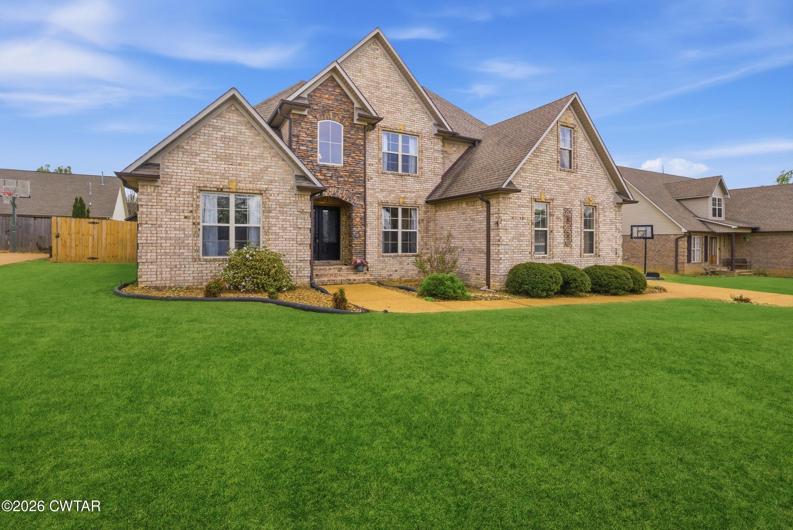 325 Harvest Ridge Lane Medina, TN 38355 - Photo 43 of 43 a front view of a house with a yard and green space