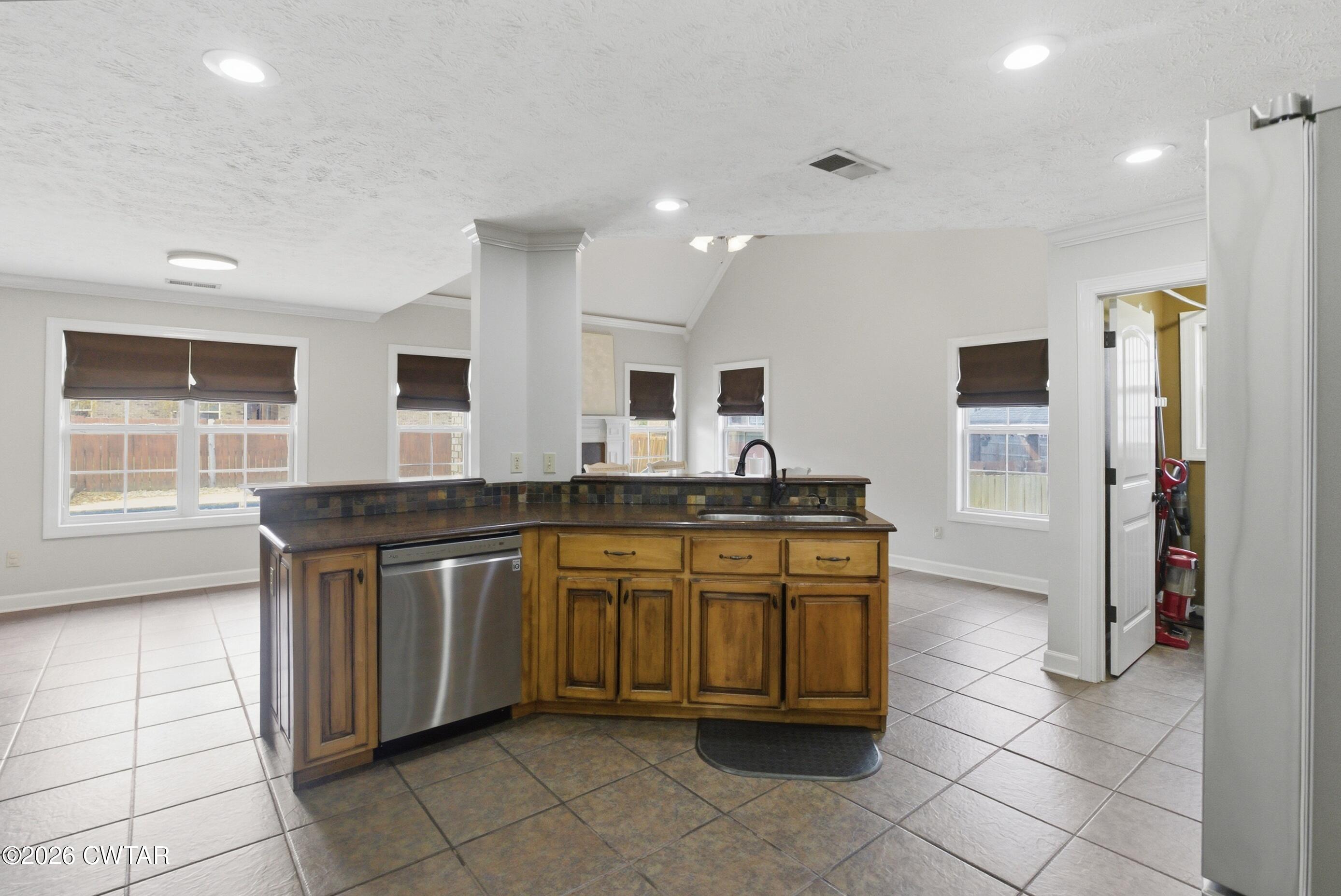 325 Harvest Ridge Lane Medina, TN 38355 - Photo 9 of 43 a kitchen with stainless steel appliances granite countertop a sink and a stove