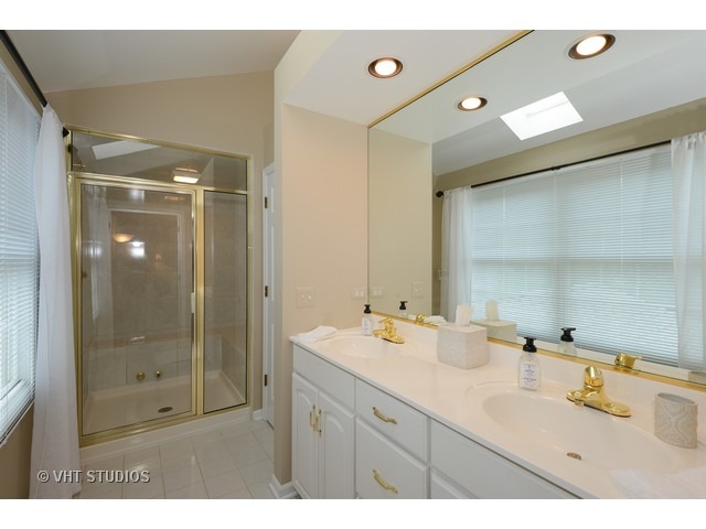976 West Bauer Road Naperville, IL 60563 - Photo 11 of 21 a bathroom with a shower sink mirror and shower