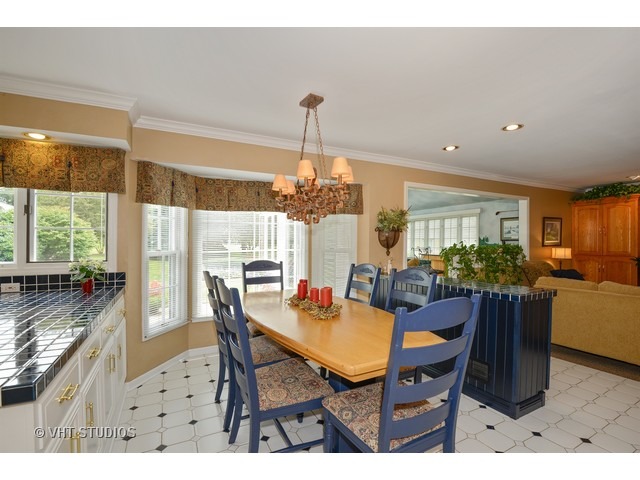 976 West Bauer Road Naperville, IL 60563 - Photo 5 of 21 a dining room with furniture a chandelier and window