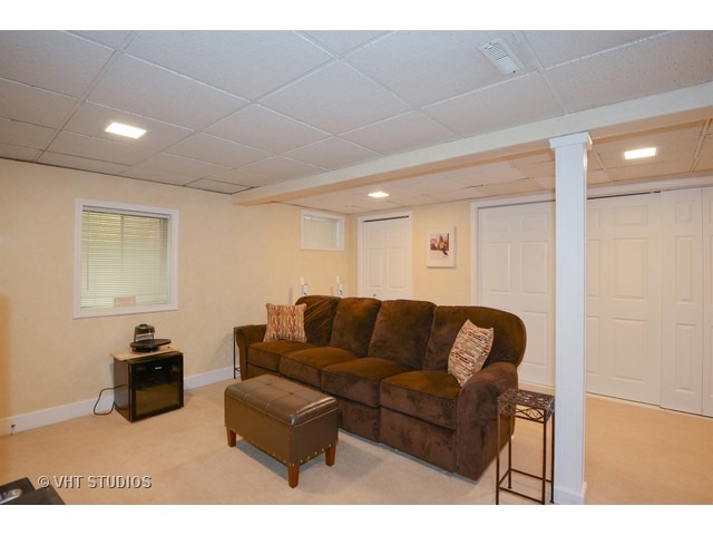 976 West Bauer Road Naperville, IL 60563 - Photo 8 of 21 a living room with furniture and a wooden floor