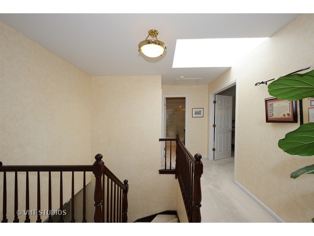 976 West Bauer Road Naperville, IL 60563 - Photo 9 of 21 a view of a hallway and a livingroom with furniture