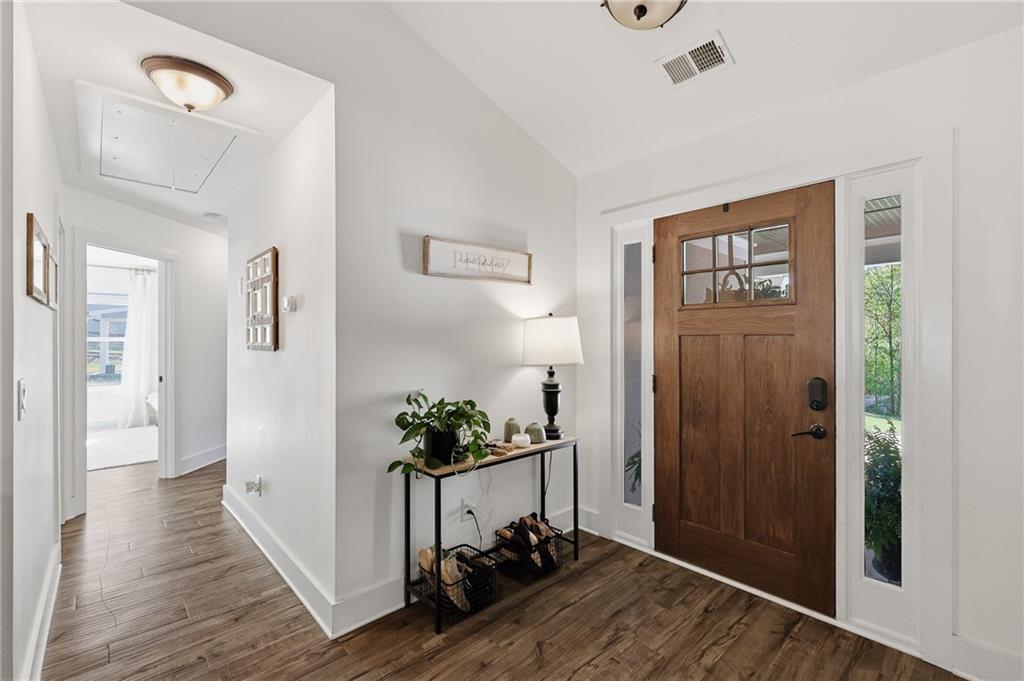 164 Mary Saphire Road Dawsonville, GA 30534 - Photo 11 of 25 a view of a hallway with a potted plant