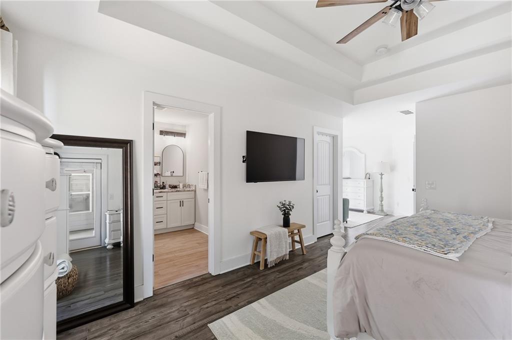 164 Mary Saphire Road Dawsonville, GA 30534 - Photo 13 of 25 a spacious bedroom with a bed and a flat screen tv