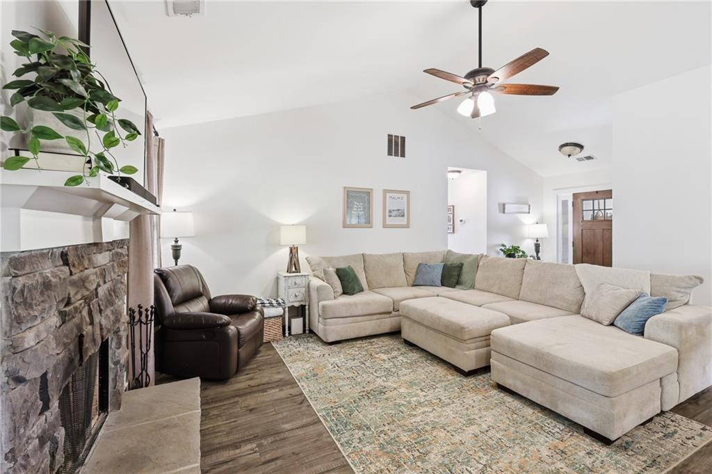 164 Mary Saphire Road Dawsonville, GA 30534 - Photo 10 of 25 a living room with furniture and a chandelier