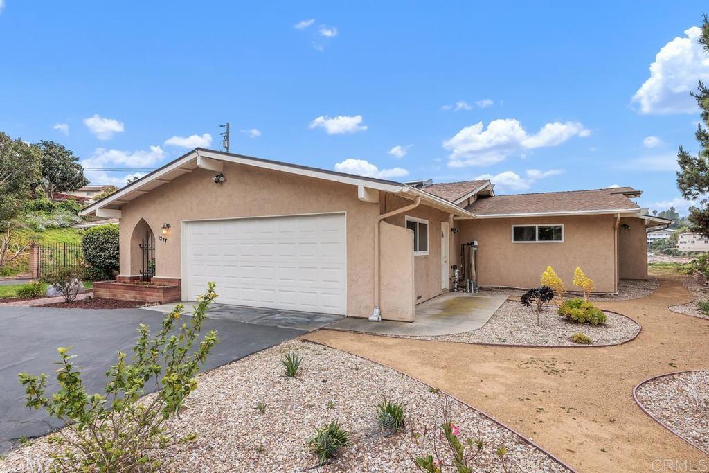 1277 Cypress Drive Vista, CA 92084 - Photo 6 of 18 a backyard of a house with sitting area