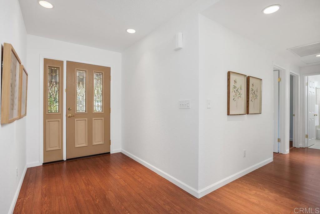 1277 Cypress Drive Vista, CA 92084 - Photo 9 of 18 an empty room with wooden floor and closet