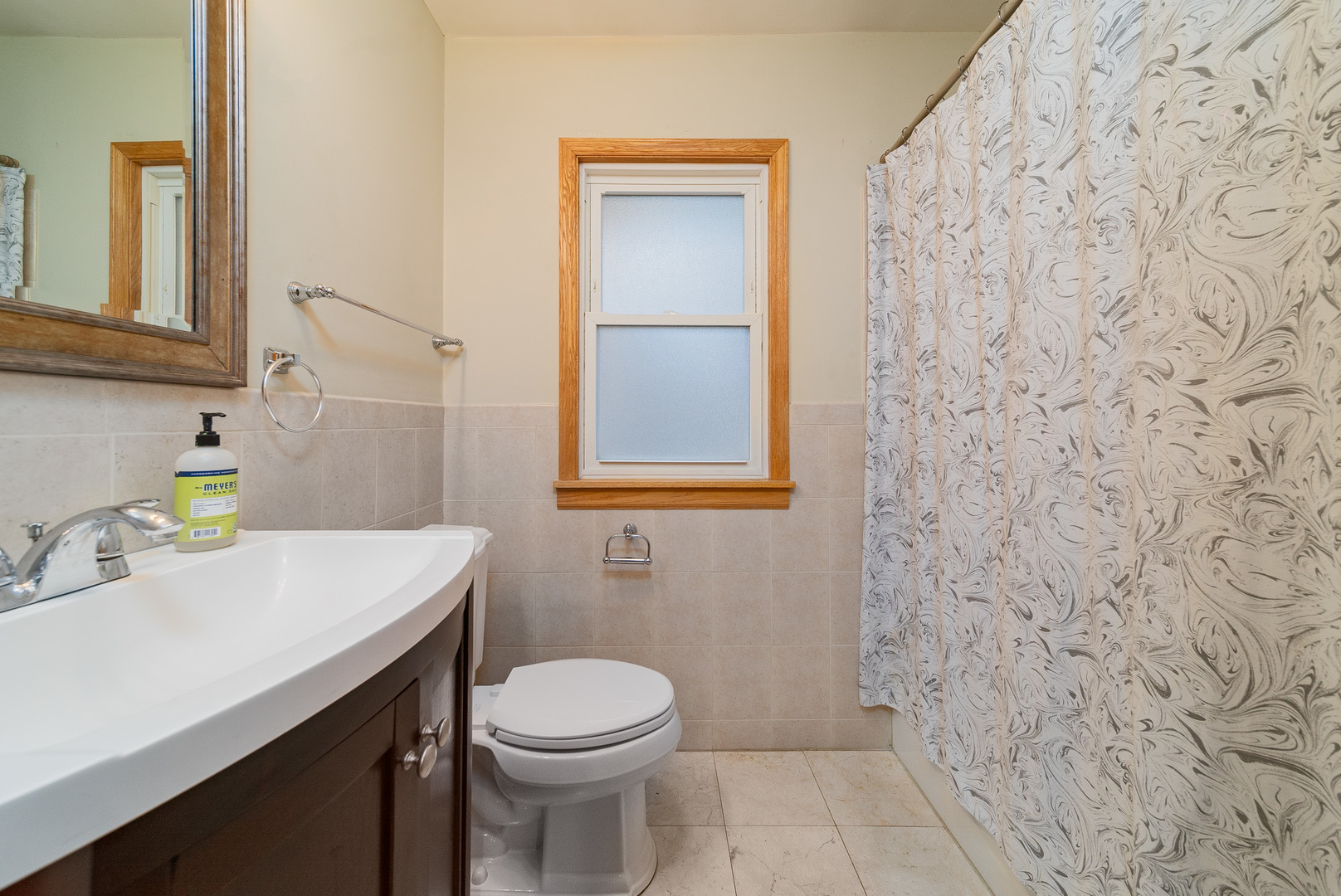 Undisclosed Address Chicago, IL 60634 - Photo 14 of 23 a bathroom with a sink a toilet and vanity