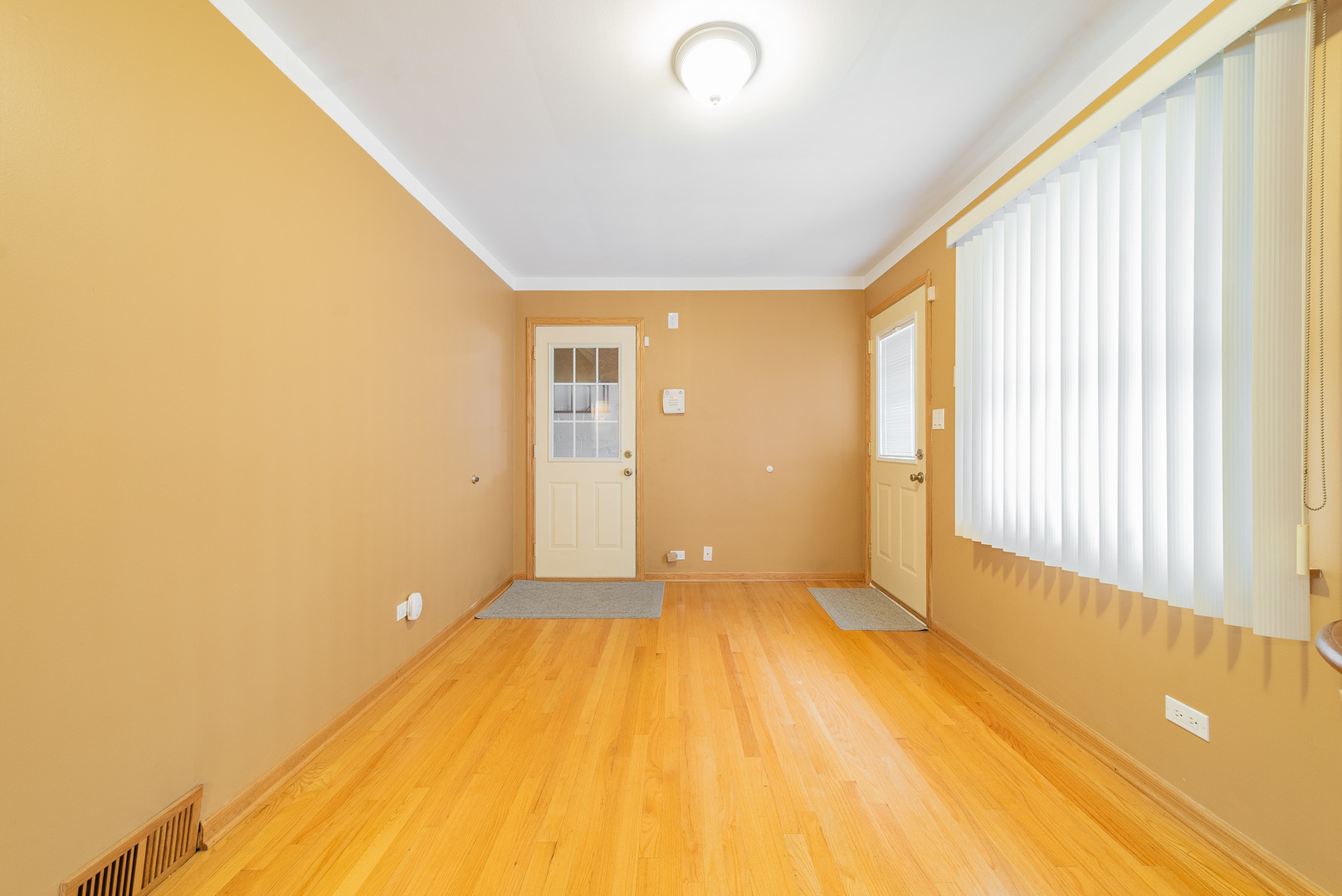 Undisclosed Address Chicago, IL 60634 - Photo 16 of 23 a view of a big room with wooden floor and windows