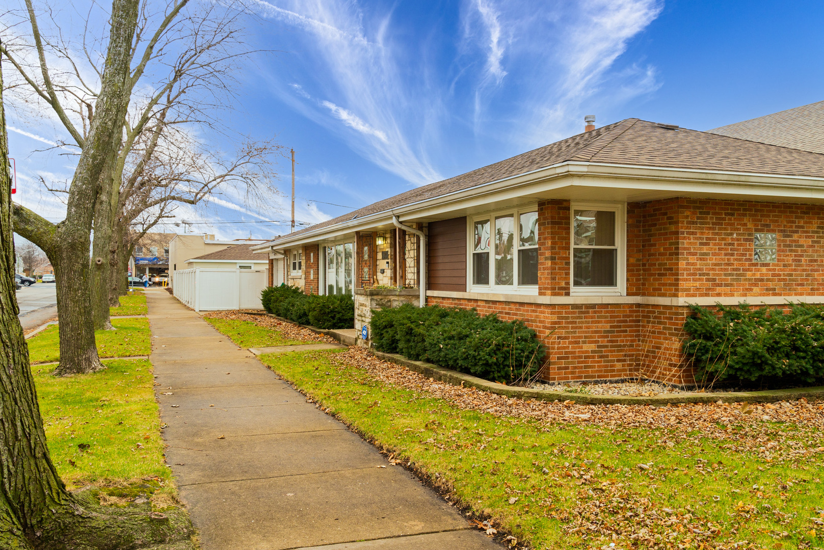 Undisclosed Address Chicago, IL 60634 - Photo 3 of 23 a front view of a house with a garden