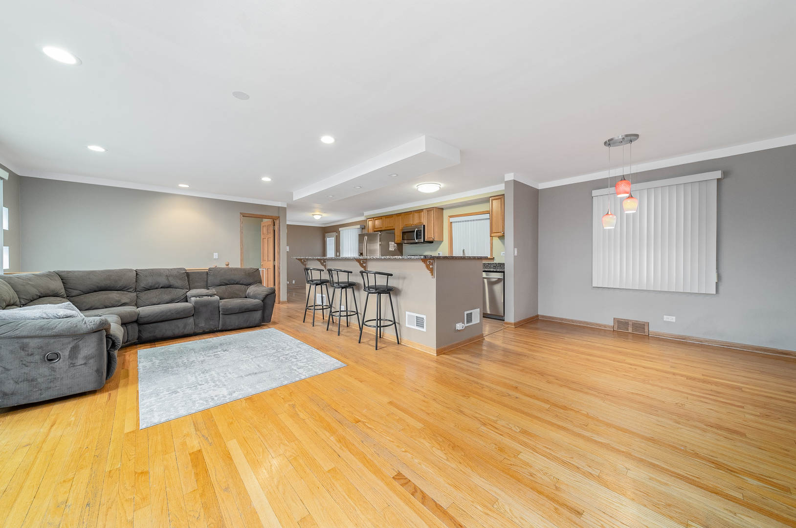Undisclosed Address Chicago, IL 60634 - Photo 4 of 23 a living room with furniture and a wooden floor