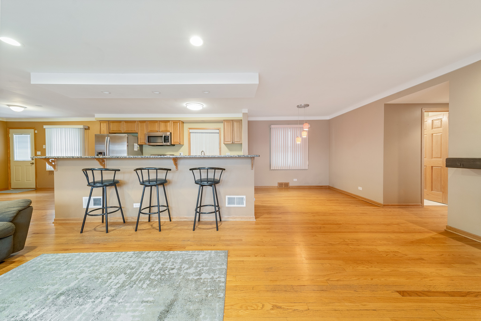 Undisclosed Address Chicago, IL 60634 - Photo 6 of 23 a view of a kitchen with furniture and wooden floor