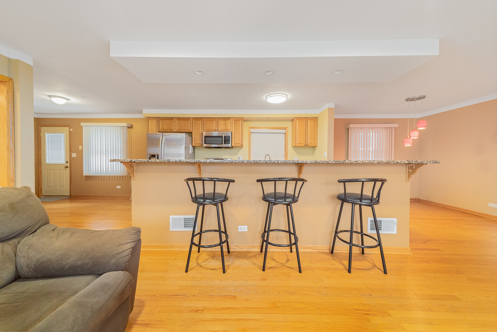 Undisclosed Address Chicago, IL 60634 - Photo 7 of 23 a living room with stainless steel appliances kitchen island granite countertop furniture and a large window