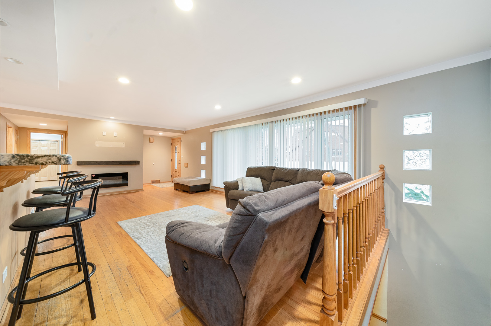 Undisclosed Address Chicago, IL 60634 - Photo 8 of 23 a living room with furniture and a wooden floor