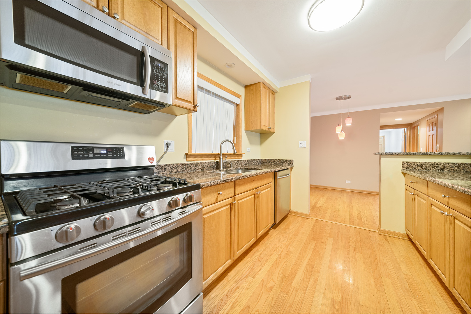 Undisclosed Address Chicago, IL 60634 - Photo 10 of 23 a kitchen with stainless steel appliances granite countertop a stove and a sink