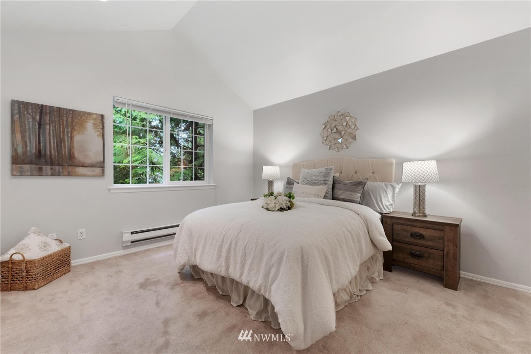 18505 Southeast Newport Way, Unit E320 Issaquah, WA 98027 - Photo 13 of 18 a bedroom with a bed and window