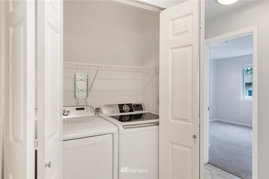 18505 Southeast Newport Way, Unit E320 Issaquah, WA 98027 - Photo 9 of 18 a utility room with dryer and washer