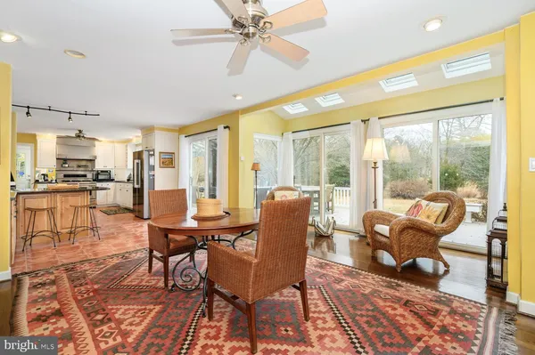 a view of a dining room with furniture wooden floor and chandelier