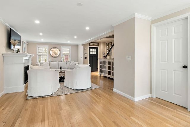 a living room with a couch and a wooden floor