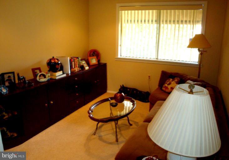 18709 Walkers Choice Road, Unit 6 Gaithersburg, MD 20886 - Photo 6 of 10 a view of a living room and dining room
