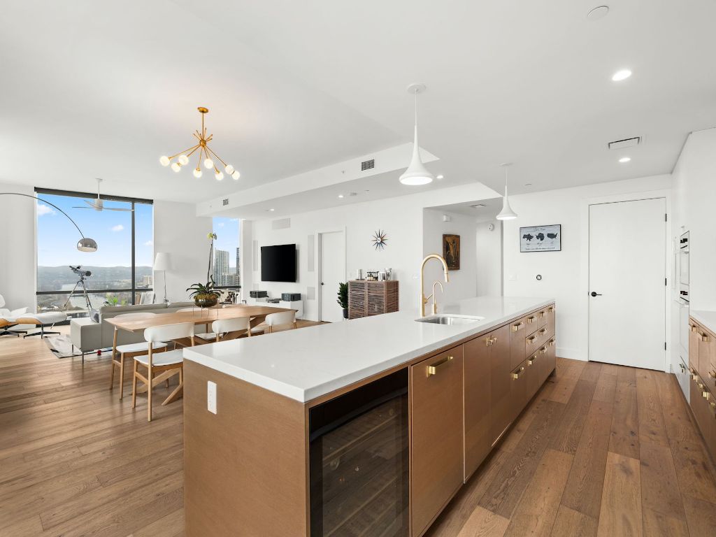 70 Rainey Street, Unit 2301 Austin, TX 78701 - Photo 40 of 40 a large white kitchen with a large island in the center